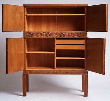 A Swedish Modern stained pine cabinet, 1940s.