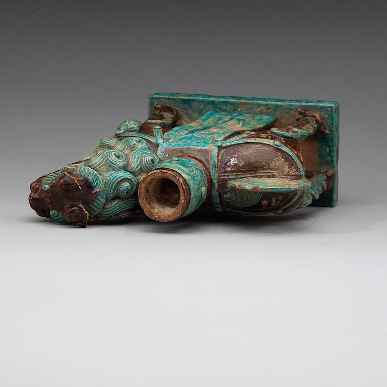 A turkoise and aubergine glazed figure of a Mythical beast, late Ming dynasty (1368-1644).