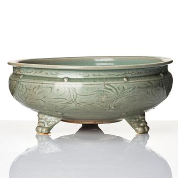 A celadon glazed tripod censer, Ming dynasty (1368-1644).