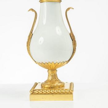 A pair of three light porcelain and gilt bronze three-branch Louis XV-style candelabra, mid 19th century.