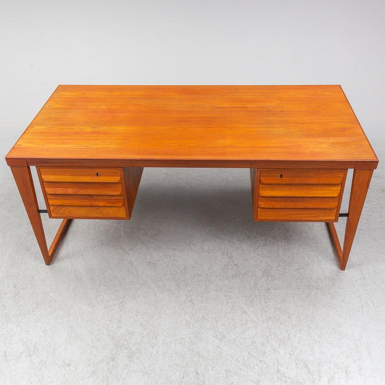A 1960's teak model 70 writing desk by Kai Kristiansen.
