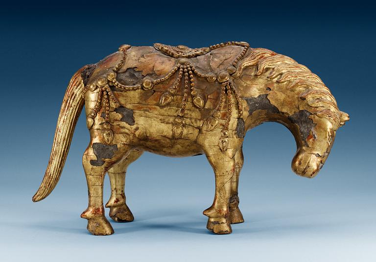 A gilt-lacquered wood sculpture of a horse, Qing dynasty, 17th/18th Century.