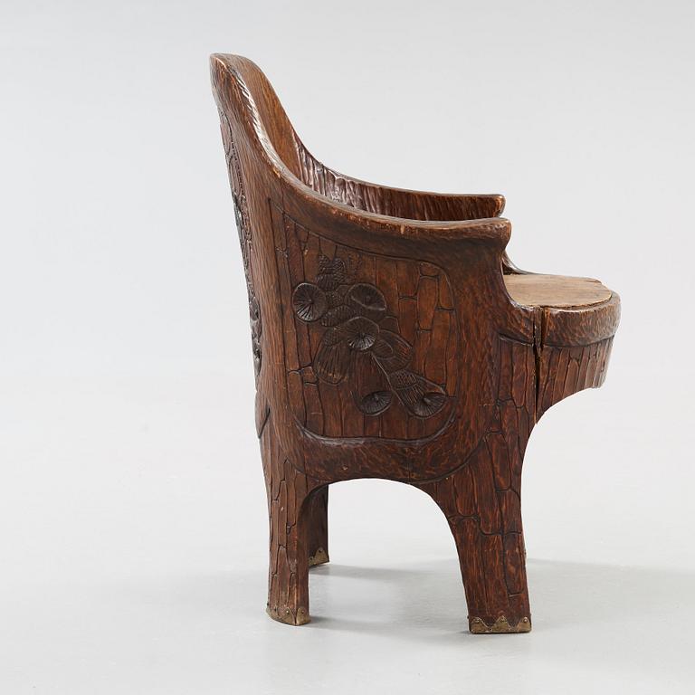 A Gustav Fjaestad Art Nouveau carved pine chair, 'Stabbestol', by Adolf Swanson, Arvika, Sweden 1908.