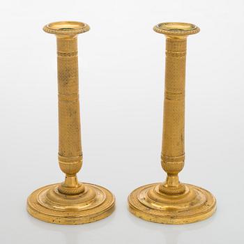 A pair of early 19th century French Empire candlesticks.