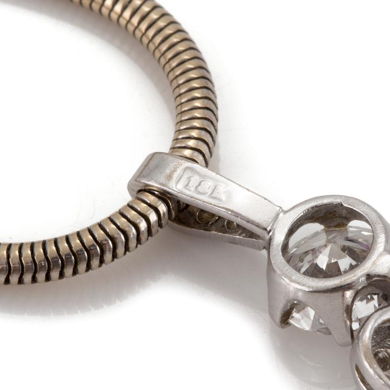 A chain and a pendant set with eight-cut and a round, brilliant-cut diamond.
