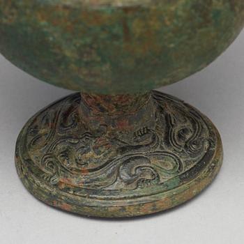 A group of five bronze objects, some Han dynasty (206 BC - 220 AD).