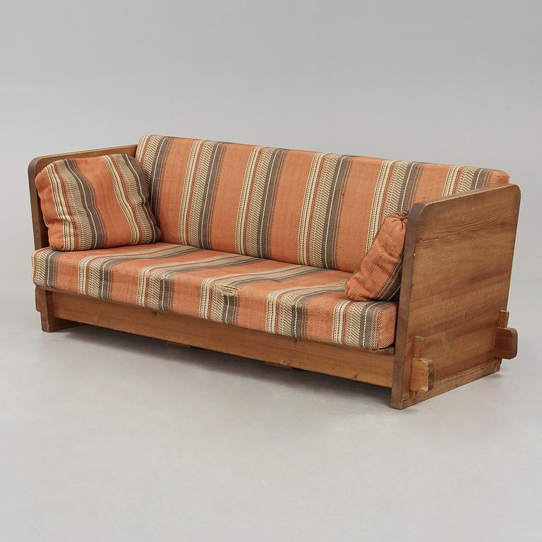 An Axel Einar Hjorth stained pine 'Lovö' sofa, Nordiska Kompaniet, Sweden ca 1930.