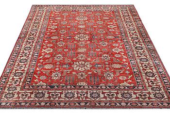 A Kazak carpet, c. 325 x 240 cm.