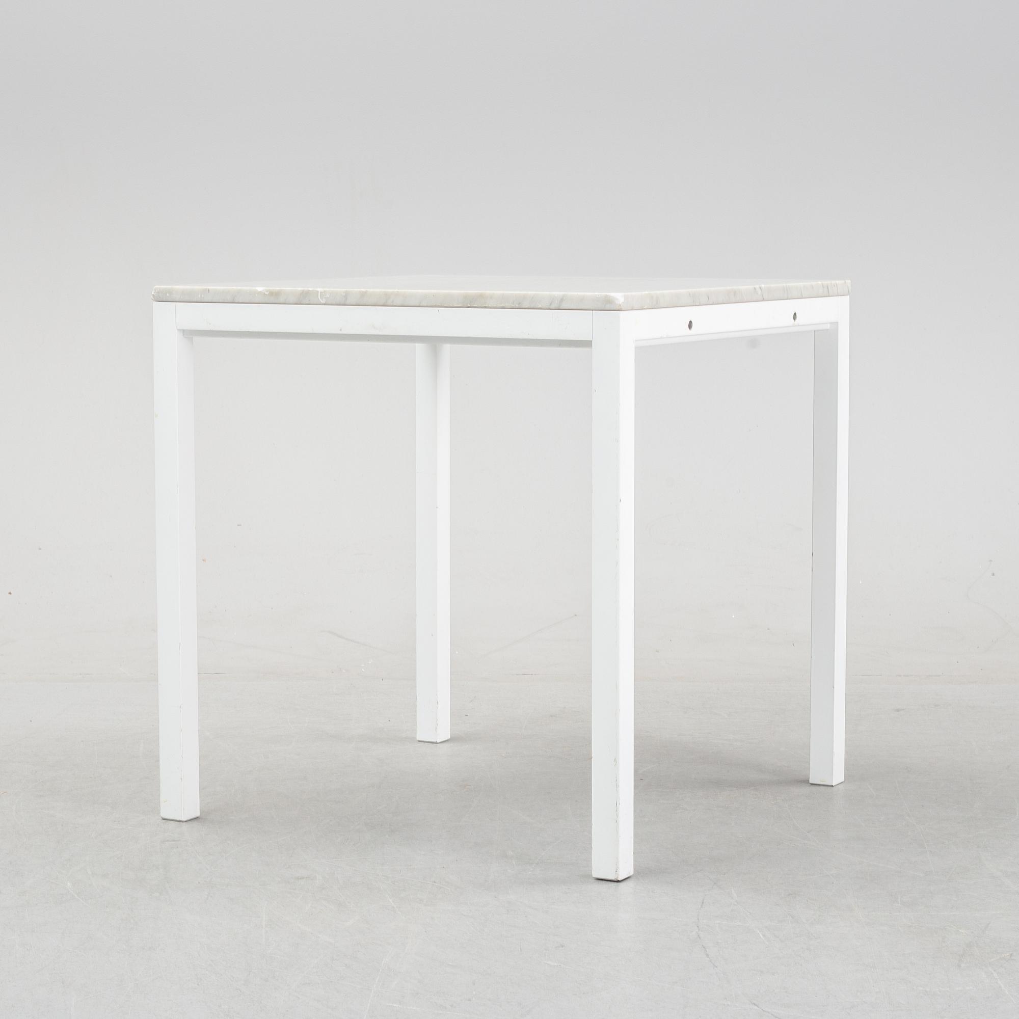 A marble top table, 21th century.