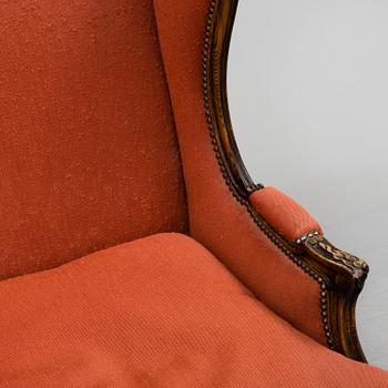 A Louis XV-style armchair, about 1900.