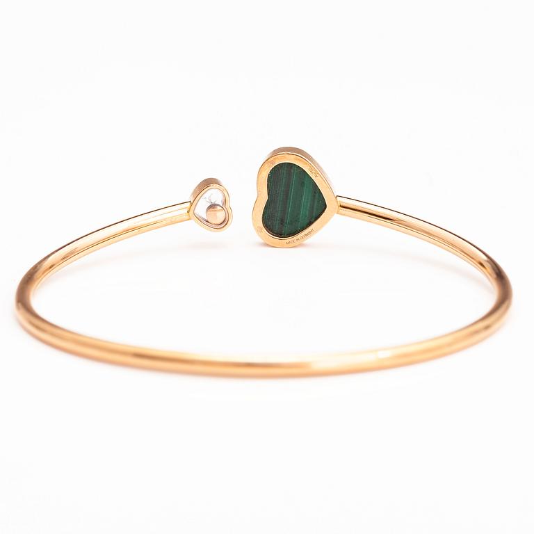 CHOPARD. A 18K gold bracelet "Happy hearts" with a diamond and malakite. Marked 857482, 6508783 and Made in Germany.