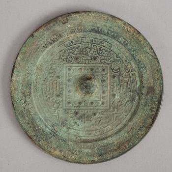 A bronze mirror, Xin-Eastern Han dynasty (9-220).