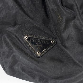 Prada, A nylon and leather backpack.