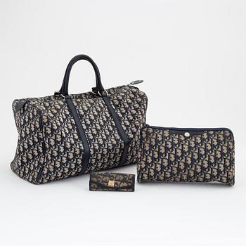 Christian Dior, a canvas handbag, toilet bag and key holder.