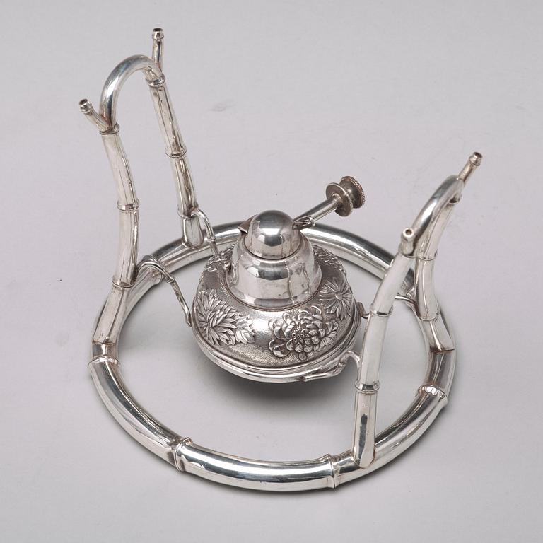 A Japanese silver tea pot with burner and stand, makers mark Samurai Shokai, Yokohama, Sterling.