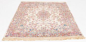 A carpet, semi-antique/old, Kerman, approx. 263 x 174 cm.