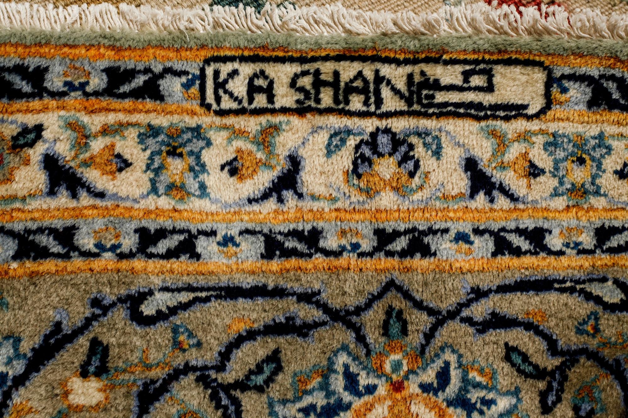 A Keshan rug, signed, ca 370 x 268 cm.