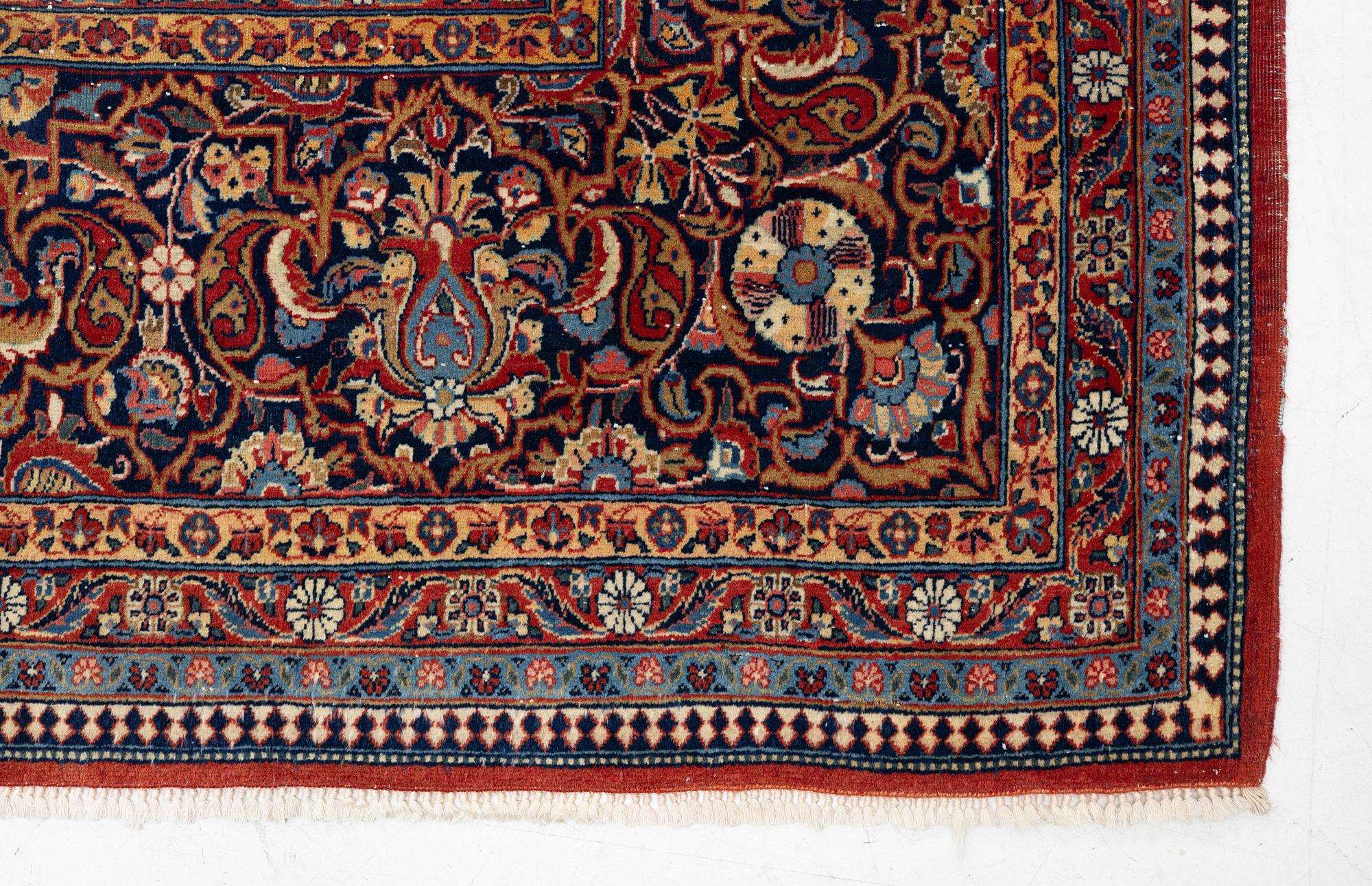 An antique Kashan Dabir carpet, c. 404 x 312 cm.