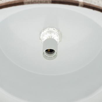 A brass and textile ceiling light. Luxus, Vittsjö.