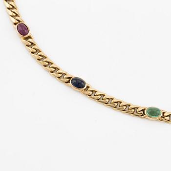 Necklace, 18K gold with cabochon-cut rubies, sapphires, and emerald.