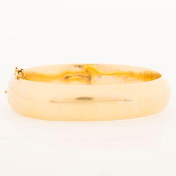 A 19th Century Russian 14K gold (56) bangle, maker's mark GS, Saint Petersburg.