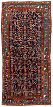 A carpet, semi-antique kurdish, circa 300 x 147 cm.