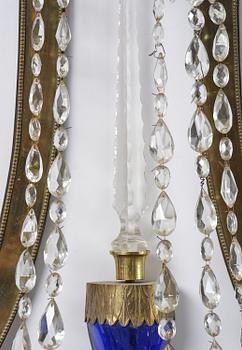 A pair of Russian Louis XVI-style  four-branch gilt bronze appliques, 19th century.