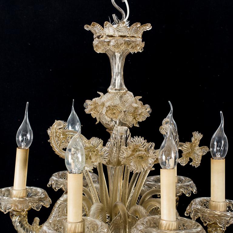 A 20th century six light Venetian style glass chandeliere.