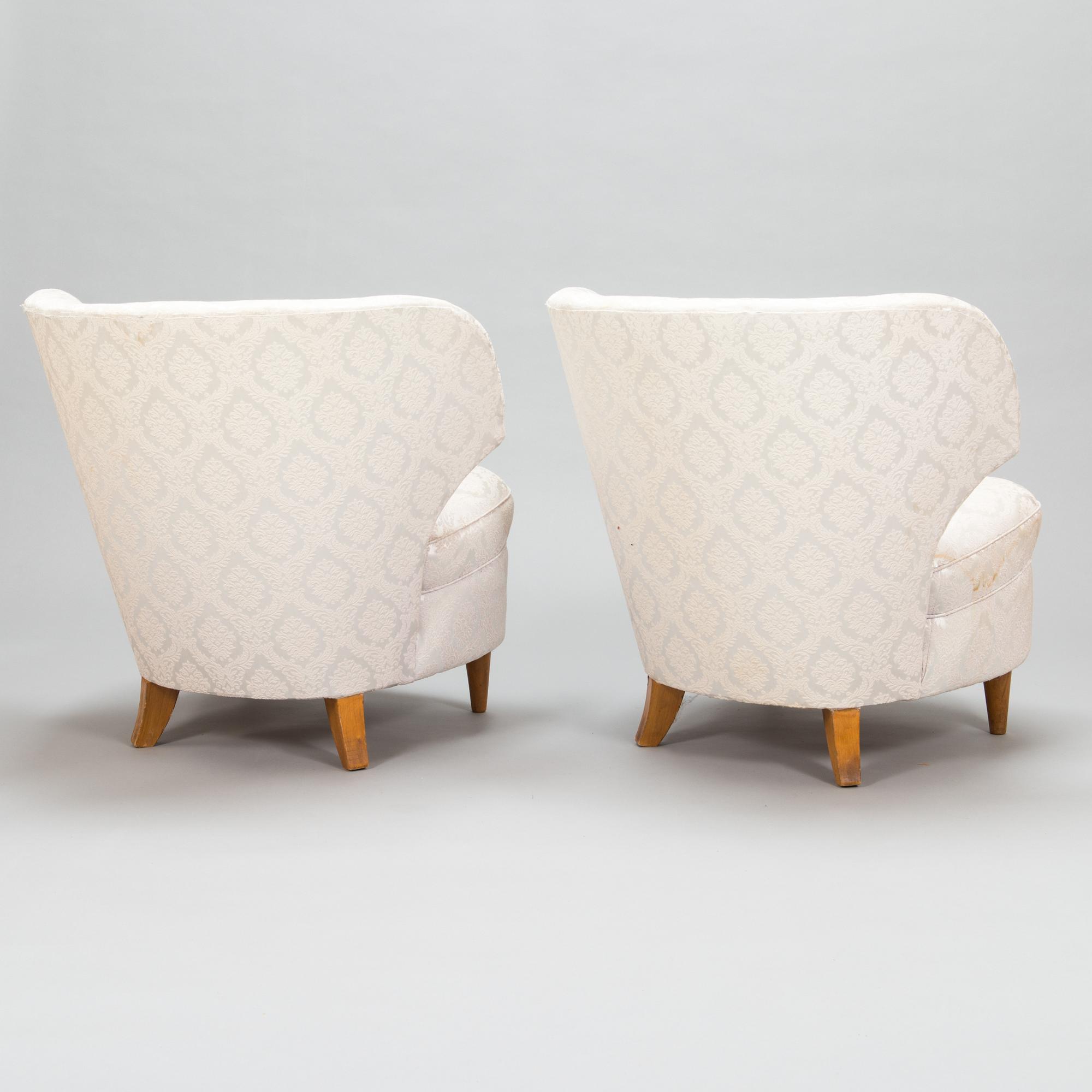 A pair of 1950's armchairs.