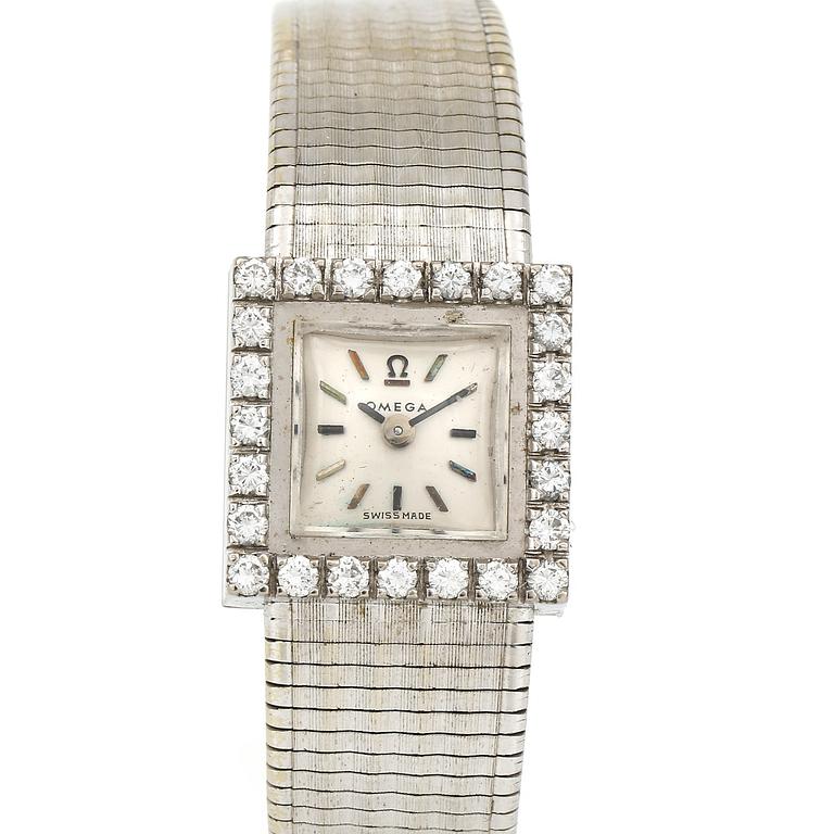 ARMBANDSUR, dam, 18K vitguld med briljantslipade diamanter, tot ca 0,72 ct, Omega. Total vikt ca 41 g.