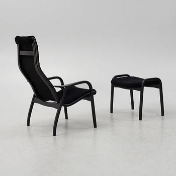 Yngve Ekström, a 'Lamino' armchair with stool, Swedese, Sweden, 2019.