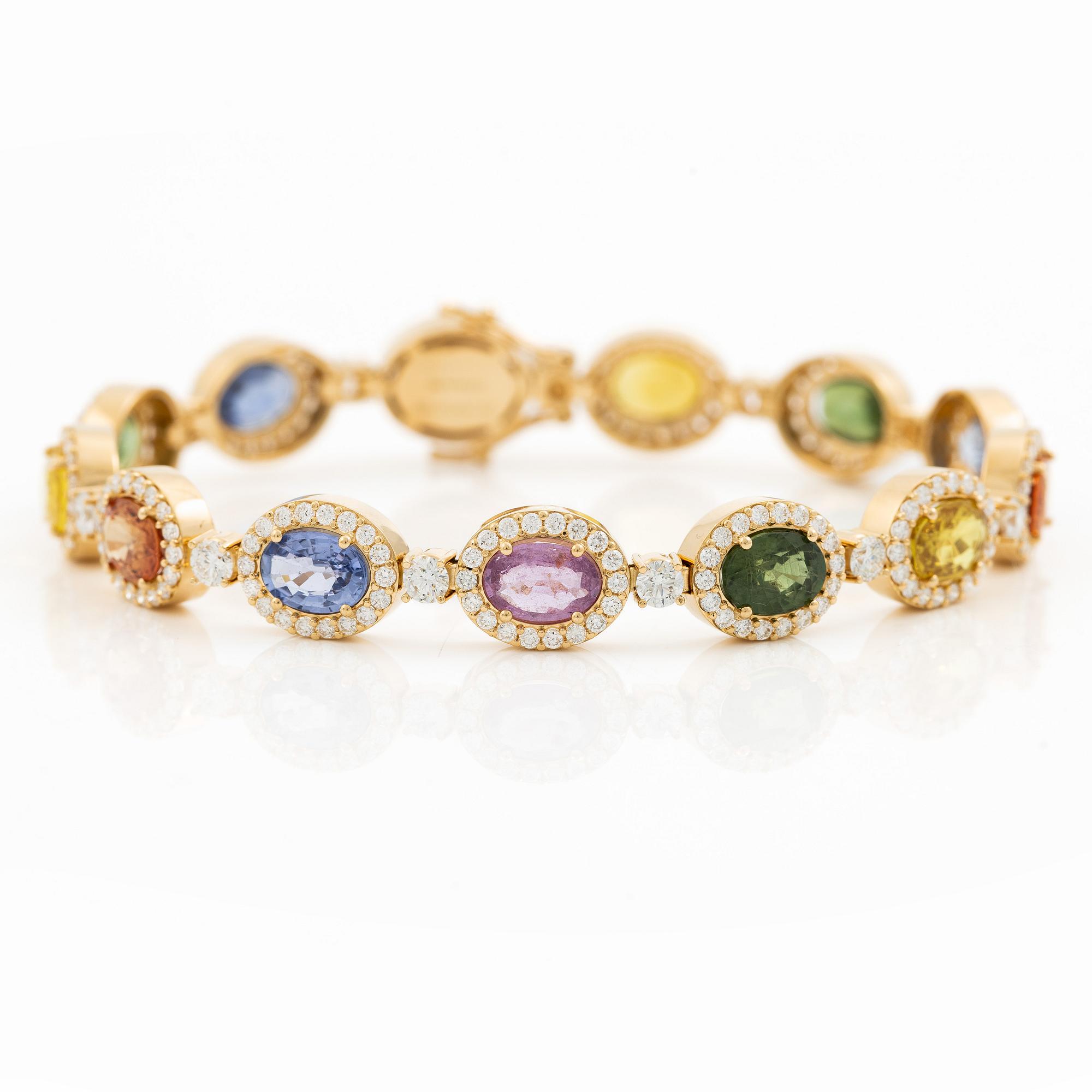 Bracelet 18K gold with oval multi-coloured sapphires and round brilliant-cut diamonds.