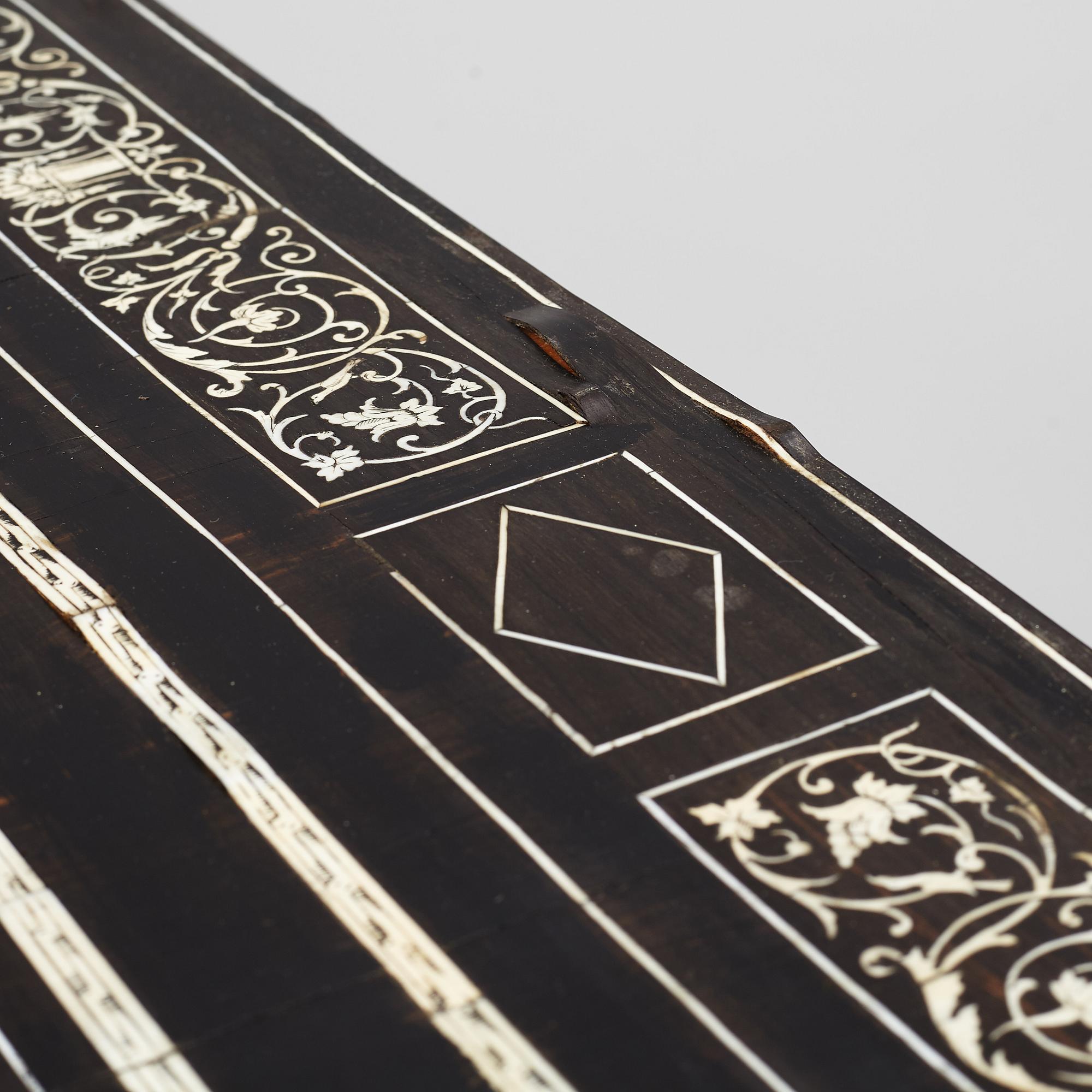 A Renaissance-style ebony, ebonized and ivory-inlaid library table, late 19th century, presumably Germany.