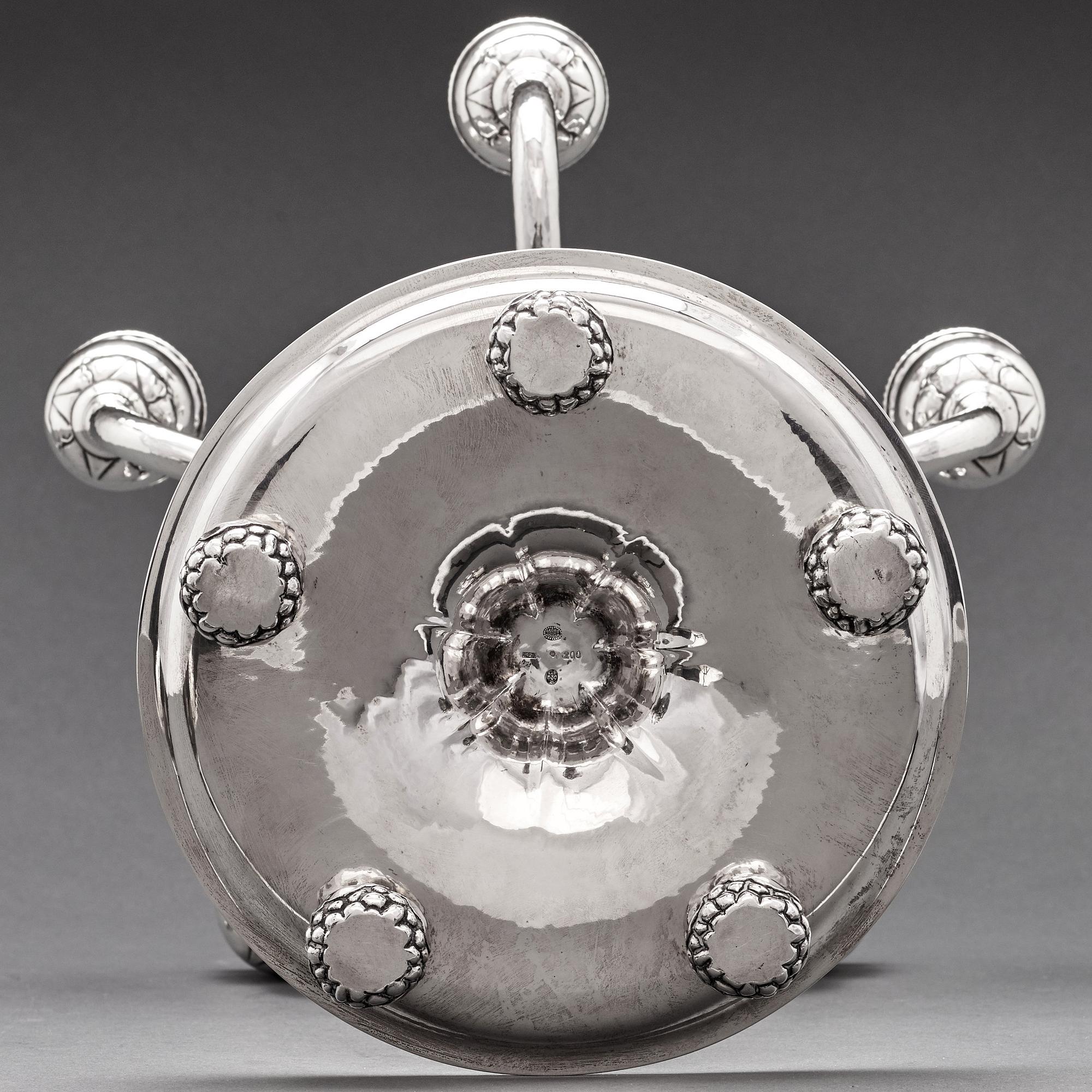 Georg Jensen, a pair of 830/1000 silver five light candelabra, Copenhagen 1920, design nr 200.