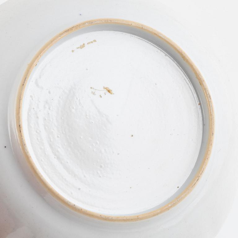 A small Chinese export tureen with cover, two cups, a saucer and a jug with cover, Qing dynasty, 18th century.