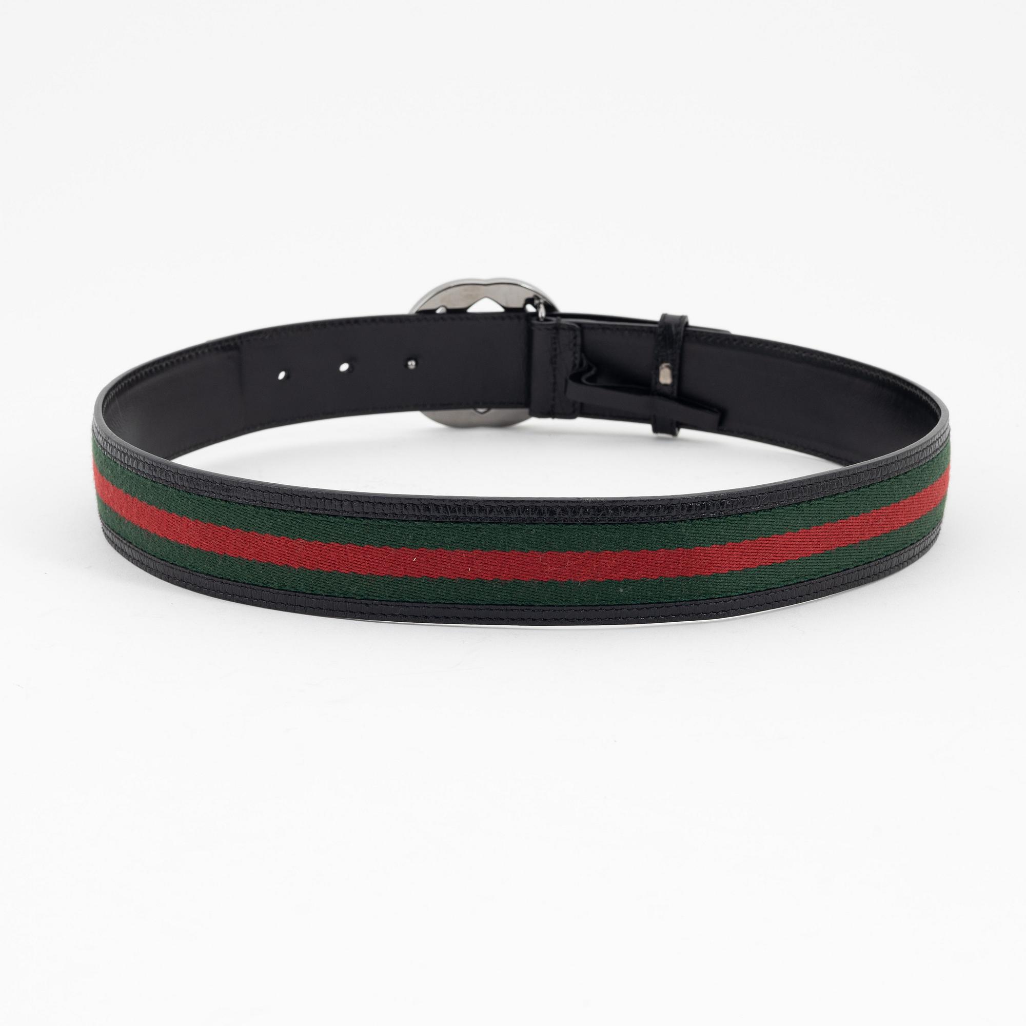 Gucci, a leather and textile belt, size 80.