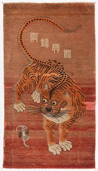 An antique Mongolian ’tiger rug’, around 1900, c. 168 x 94 cm.