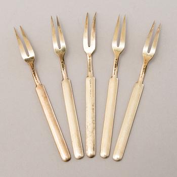 A 1950s silver cocktail shaker, 6 cocktail sticks and five enamelled forks, Kultakeskus och Tillander, Finland.