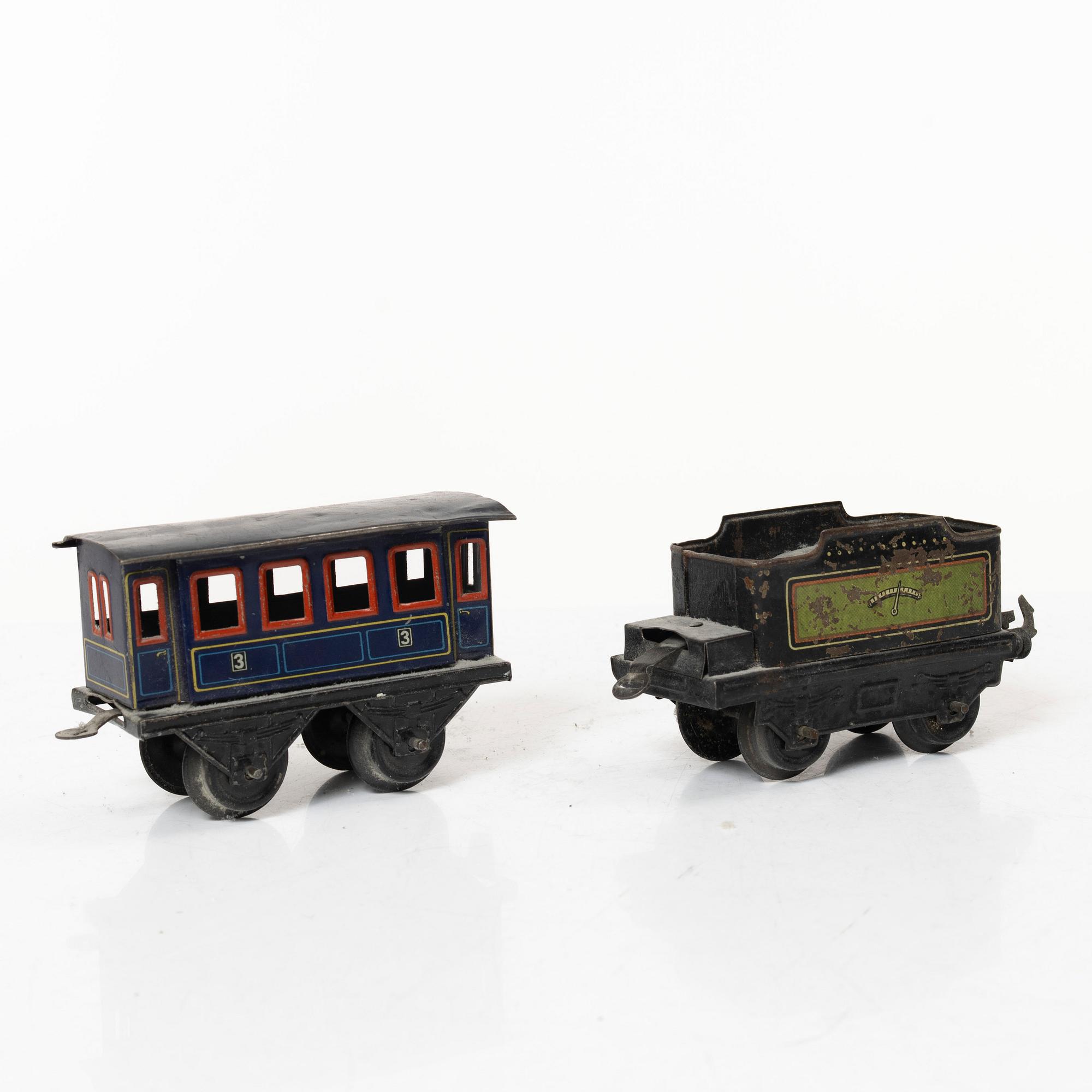 Model train with track and station building, 13 pieces, Germany, 1920s.