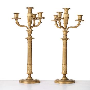 A pair of French Empire early 19th century four-light candelabra.