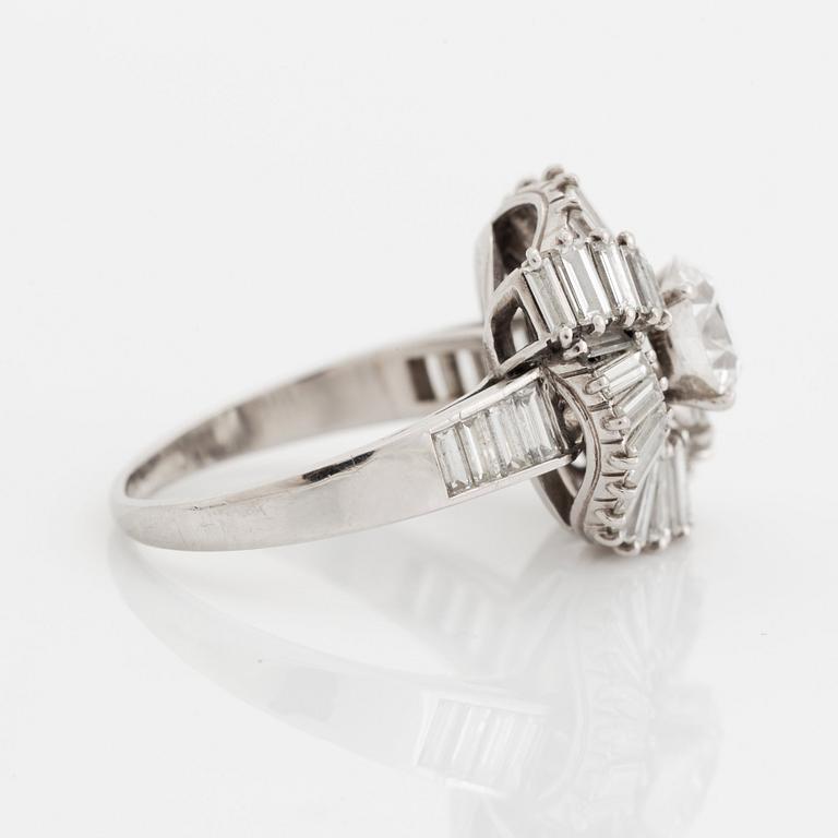 A Boucheron platinum ring set with a round brilliant-cut diamond weight ca 1.25 cts quality ca H vvs.