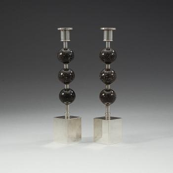 Sigurd Persson, a pair of silver plated and porphyry candlesticks, Sweden.