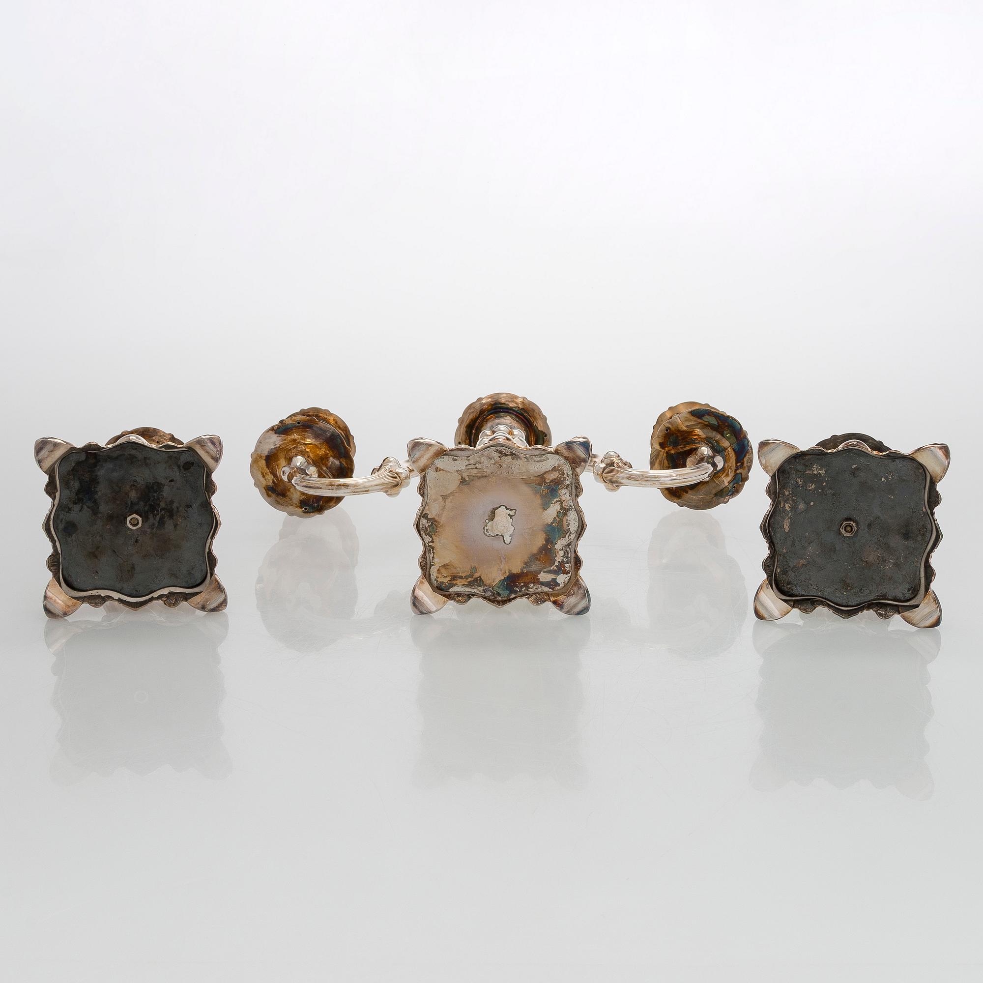 A silver candelabra and a pair of silver candlestick, Kultakeskus Hämeenlinna 1962 and 1985.