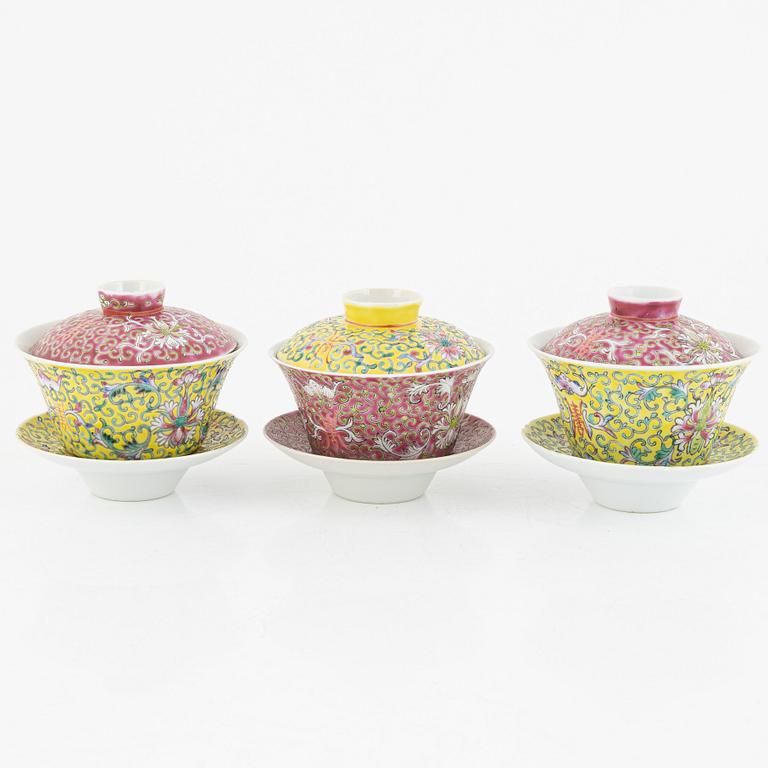 A group of three Chinese enamelled porcelain cups with covers and stands, three small dishes, 20th century.