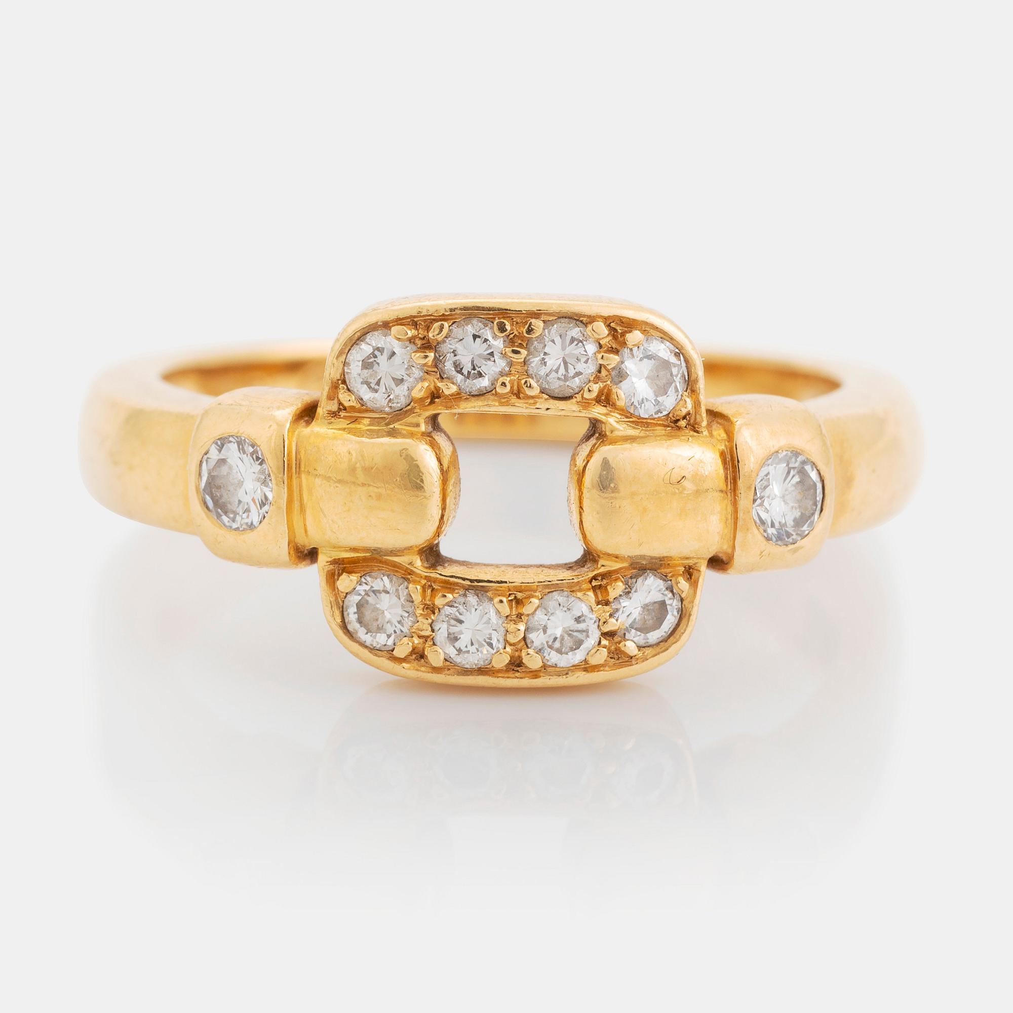 An 18K gold Cartier ring set with round brilliant-cut diamonds.