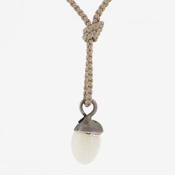 Ole Lynggaard, pendant, "Lotus", gold and silver with small brilliant-cut diamonds and likely moonstone.