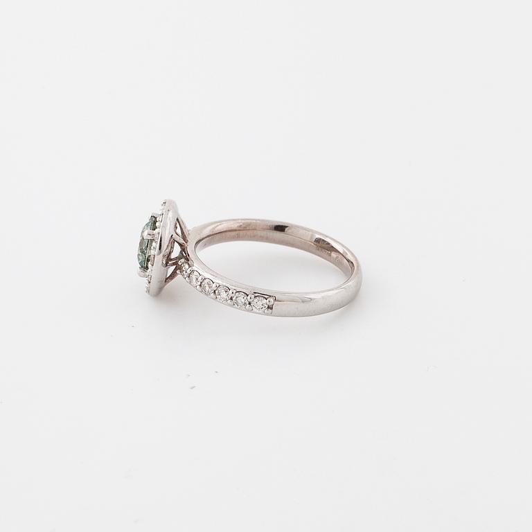 A treated green diamond and briliant cut diamonds.