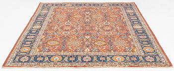 An antique/semi antique Tabriz carpet, c. 325 x 229 cm.