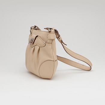 SALVATORE FERRAGAMO, a beige leather shoulder bag and a pair of beige leather loafers.