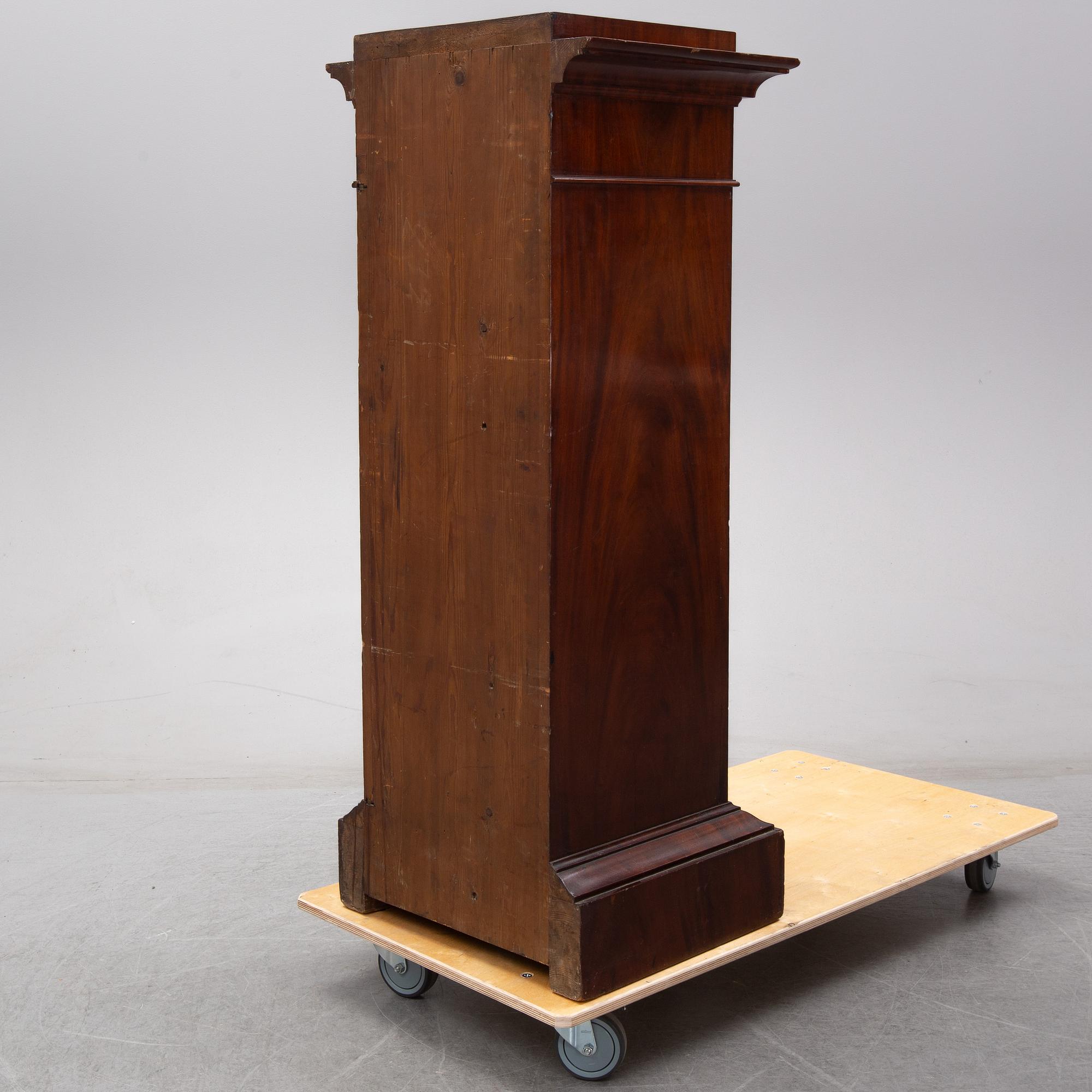 An early 19th Century empire mahogany cabinet.